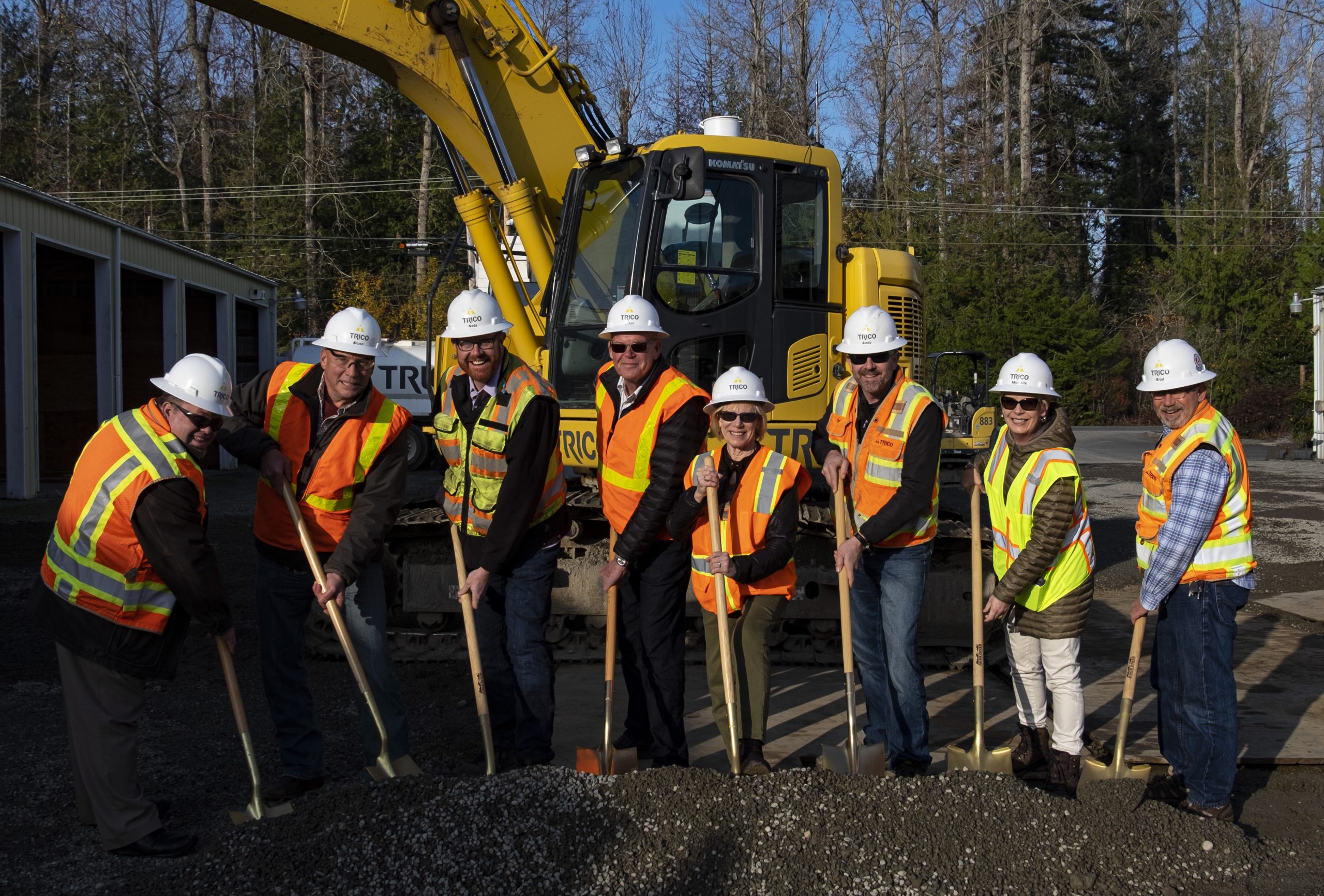 breaking the dirt group photo with gold shovels