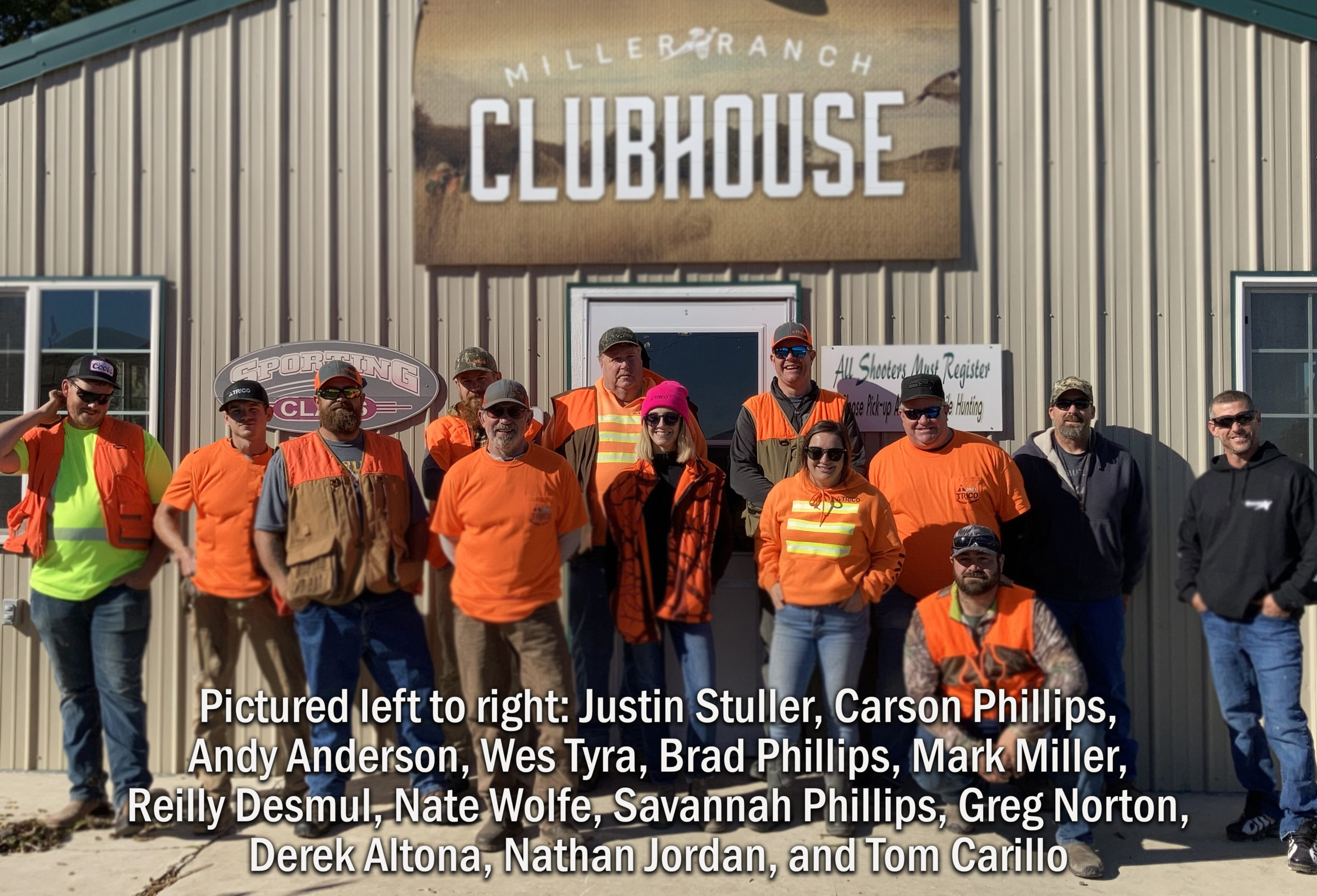group photo in front of clubhouse