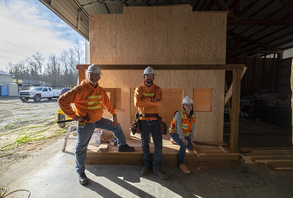 three trico employees posing